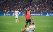 Jonathan Tah of Bayer 04 Leverkusen speaks to Alvaro Morata of AC Milan during the UEFA Ch...