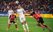 Alvaro Morata of AC Milan and Jonathan Tah of Bayer 04 Leverkusen are in action during the...