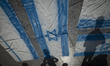 Iranian people stand next to Israeli flags that are prepared to set on fire during a gathe...