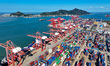 The container terminal production scene takes place in Lianyungang, Jiangsu Province, Chin...