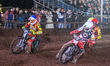 Dan Bewley of Belle Vue Aces, in white, rides inside Richard Lawson of Leicester Lions, in...