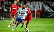 Fenerbahce defender Alexander Djiku and FC Twente forward Sam Lammers play during the matc...