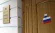 Stickers with the Russian tricolor flag are pasted on the doors of the Iranian Embassy by...