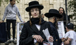 Orthodox Jewish pilgrims pray near the tomb of Rabbi Nachman while celebrating Rosh Hashan...