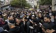 Orthodox Jewish pilgrims pray near the tomb of Rabbi Nachman while celebrating Rosh Hashan...