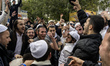 Orthodox Jewish pilgrims dance outside the tomb of Rabbi Nachman while celebrating Rosh Ha...