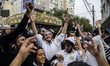Orthodox Jewish pilgrims dance outside the tomb of Rabbi Nachman while celebrating Rosh Ha...