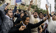 Orthodox Jewish pilgrims dance outside the tomb of Rabbi Nachman while celebrating Rosh Ha...