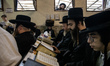 Orthodox Jewish pilgrims pray near the tomb of Rabbi Nachman while celebrating Rosh Hashan...