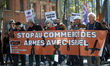 The banner reads 'Stop the selling of arms to Israel'. Hundreds of people demonstrate in T...