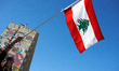 A protester waves the Lebanese flag. Hundreds of people demonstrate in Toulouse, France, o...