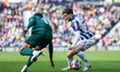 #22, Mikey Johnston of WBA attempts to get past #11, Femi Azeez of Millwall during the Sky...