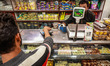 A person purchases sweets from a shop in Sopore, Jammu and Kashmir, India, on October 5, 2...