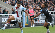 Leicester Tigers' Anthony Watson breaks past Newcastle Falcons' Elliott Obatoyinbo during...