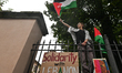 KRAKOW, POLAND - OCTOBER 5:Pro-Palestinian activists gathered in front of the fence of th...