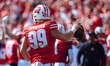 Wisconsin Badgers safety Cayson Pfeiffer #99 recovers a fumbled punt against the Purdue Bo...