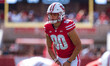 Wisconsin Badgers kicker Nathanial Vakos #90 lines up an extra point against the Purdue Bo...