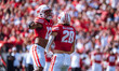Wisconsin Badgers linebacker Christian Alliegro #28 and cornerback Max Lofy #12 celebrate...