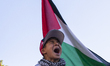 A boy chants during a pro-Palestinian rally as part of an international day of action near...