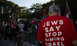 A person wears a red shirt with the text ''Jews Say Stop Arming Israel'' during a pro-Pale...
