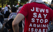 A person wears a red shirt with the text ''Jews Say Stop Arming Israel'' during a pro-Pale...