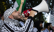 A demonstrator chants during a pro-Palestinian rally as part of an international day of ac...