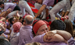 Members of Colla Jove Xiquets de Tarragona celebrate the victory after building a human to...