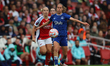 Caroline Olsen of Everton beats Arsenal's Beth Mead to the ball during the Barclays FA Wom...