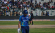 New Zealand's Martin Guptill walks off after being dismissed by Ravi Jangid of India durin...