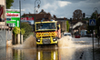 A fire truck drives over a flooded street in Coulommiers, Seine-et-Marne department, east...