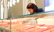 A staff member arranges gold ornaments at a gold shop in Renhuai, China, on October 11, 20...