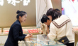 Consumers shop for gold jewelry at a gold store in Renhuai, China, on October 11, 2024. 