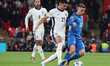 Dimitris Pelkas of Istanbul Basaksehir, Greece, holds off Dominic Solanke of Tottenham Hot...