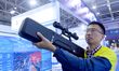An exhibitor displays unmanned aerial vehicle (UAV) control equipment at the 9th China Adv...