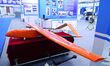 An exhibitor shows a target machine at the 9th China Advanced Materials Industry Expo 2024...