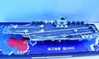 An exhibitor shows a model of the aircraft carrier Fujian at the 9th China Advanced Materi...