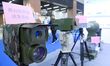 An exhibitor displays a black and white low-light imaging system at the 9th China Advanced...