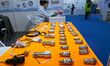 An exhibitor shows a dual-use connector at the 9th China Advanced Materials Industry Expo...