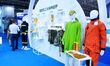 An exhibitor displays special protective clothing at the 9th China Advanced Materials Indu...