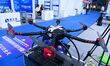 An exhibitor shows a drone at the 9th China Advanced Materials Industry Expo 2024 in Qingd...