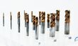 An exhibitor displays a new material composite drill bit at the 9th China Advanced Materia...