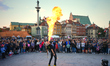 A street performer is seen spitting fire and flames in Warsaw, Poland on 12 October, 2024....