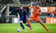 Sweden player Jacob Ondrejka and Netherlands player Devyne Rensch participate in the match...