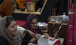 An Iranian female artist works at a stand during the 11th National Handicrafts and 3rd Int...