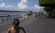 Children play at the municipal spa located at the mouth of the Amazon River in Afua, Para,...
