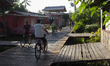 People ride bicycles in the streets of the city known as the city of bicycles, located at...