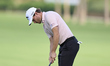 Rasmus Hojgaard of Denmark plays a shot on the 14th green on day one of the Estrella Damm...