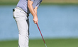 Sam Bairstow of England plays a shot on the 14th green on day one of the Estrella Damm N.A...