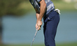 Marco Penge of England plays his shot on the 14th green on day one of the Estrella Damm N....