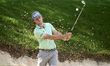 Freddy Schott of Germany plays his shot out of a bunker on the 14th hole on day one of the...